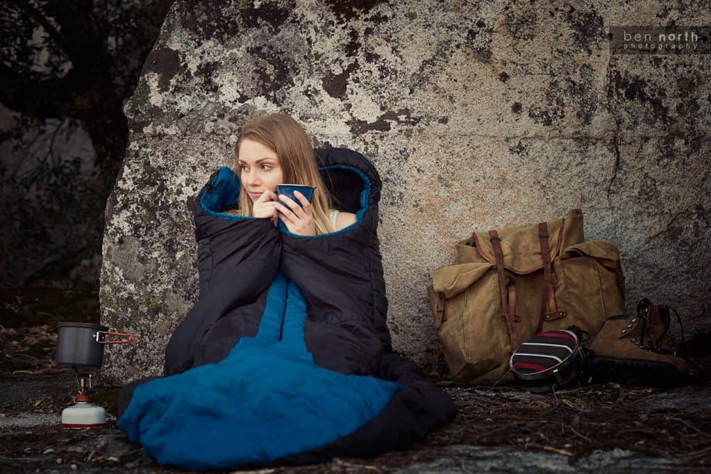 Outdoor Lifestyle Photoshoot - Woman drinking coffee on a backpacking trip.