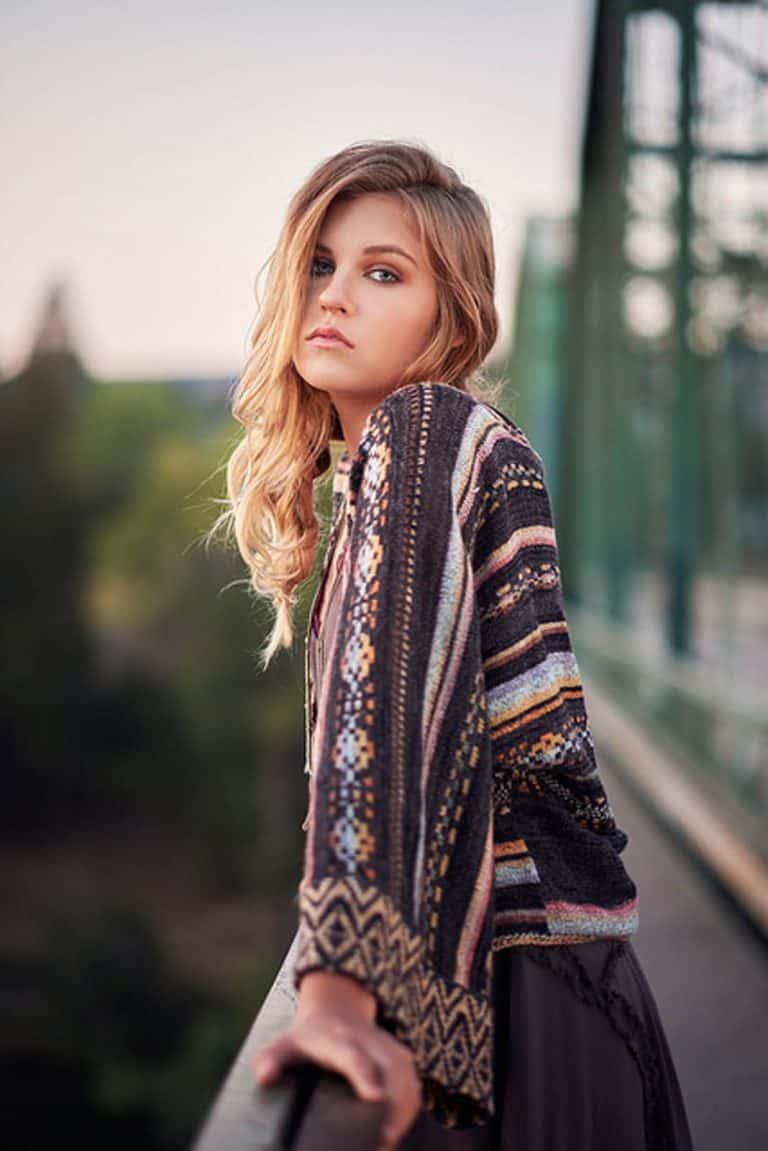 Young woman wearing Free People sweater.
