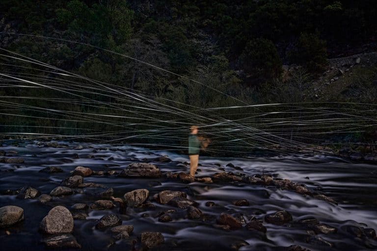 long exposure of a fly fisherman at night