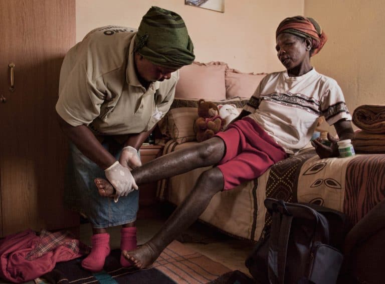 Home care volunteer working with a client in Swaziland